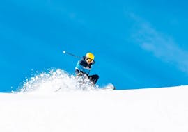 A skier on the slopes during the Private Ski Lessons for Adults of All Levels with Scuola Sci Scie di Passione Folgaria.