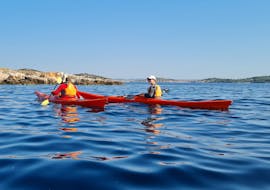 Two participants enjoying the Private Full Day Kayak Tour from Zlarin with Peak & Paddle Šibenik on the water.