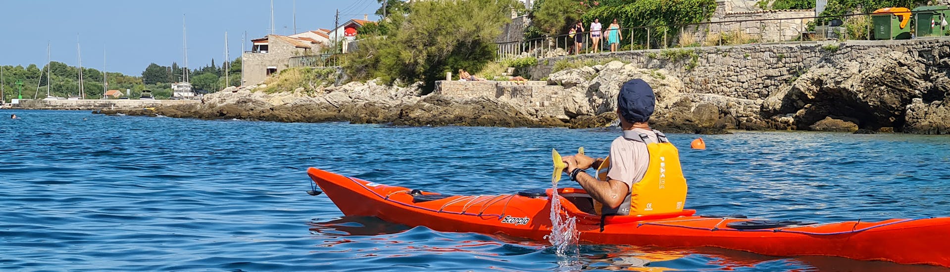 One participant of the Private Island Hopping Sea Kayak Tour from Zlarin - Full Day with Peak & Paddle Croatia Šibenik from Zlarin - Full Day in a kayak on the water.