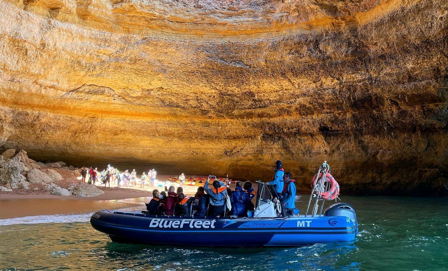 People on the boat enjoying the view of the Benagil Cave during the Private Boat Trip to the Benagil Cave from Lagos with BlueFleet Lagos.