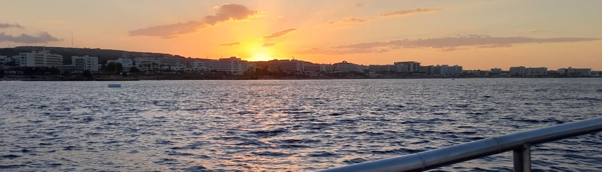 The sunset seen on the Sunset Boat Trip from Pernera to Blue Lagoon & Cape Greco with Ayia Trias Cruises Cyprus.