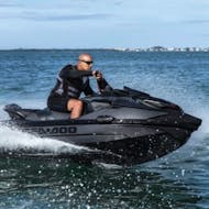 Man riding on a jet ski rented from Boat2Go.
