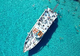 Aerial view of the ship of Kavos cruises in the blue water.