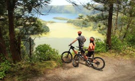 A couple enjoying the great view on blue lagoon during a E-Bike Self Guided tour in Sete Cidades with Fun Activities Azores Adventures.