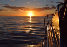 View of the sunset at its peak during the Private Sunset Trip with Snorkeling in Madeira with On Tales Whales and Dolphins - Madeira.