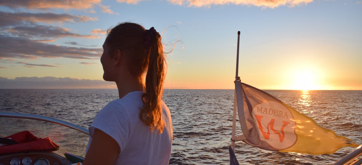 Our captain admires the sunset during the Private Sunset Trip with Snorkeling in Madeira with On Tales Whales and Dolphins - Madeira.