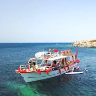 Large group enjoying a boat trip along the coast of Ibiza with Salvador Ibiza.