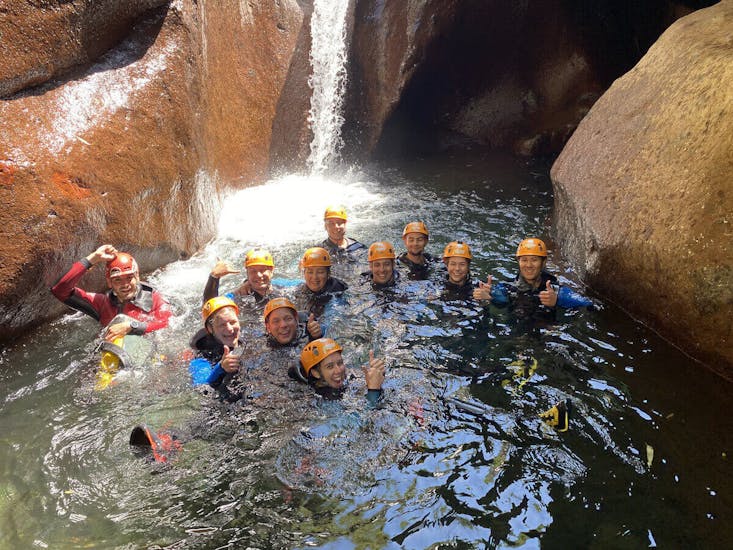 A group of friends in the water during the Sportive Canyoning in Ribeira do Cidrão with Madeira Adventure Kingdom.