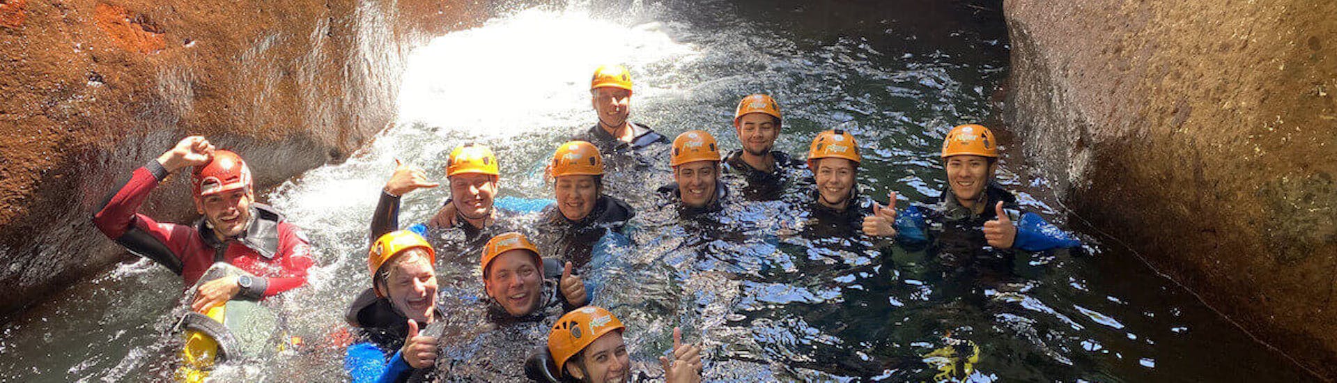 A group of friends in the water during the Sportive Canyoning in Ribeira do Cidrão with Madeira Adventure Kingdom.
