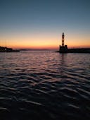 Vista del faro di Lazaretta durante il Giro in barca con fondo di vetro a Lazaretta al tramonto con Captain Nestor.
