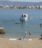 People relaxing on the beach during a Glass-Bottom Boat Trip to Thodorou and Lazaretta with Captain Nestor Chania.