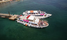 The boat at the coast during the Party Boat Trip from Corfu to Blue Lagoon with Captain Theo Corfu Cruises.