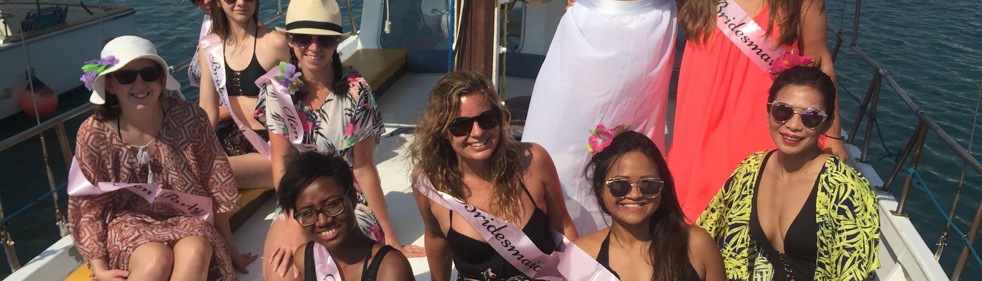 The bride and the bridesmaid are on the boat during a Private Boat Trip along the Cretian Coastline with Zorbas Cruises Hersonissos.