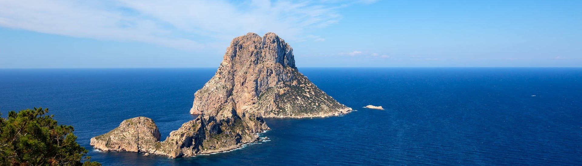 The Islet of Secrets viewed from the sky during the Catamaran Trip to Es Vedrà with Apéritif with Sea Experience Ibiza.