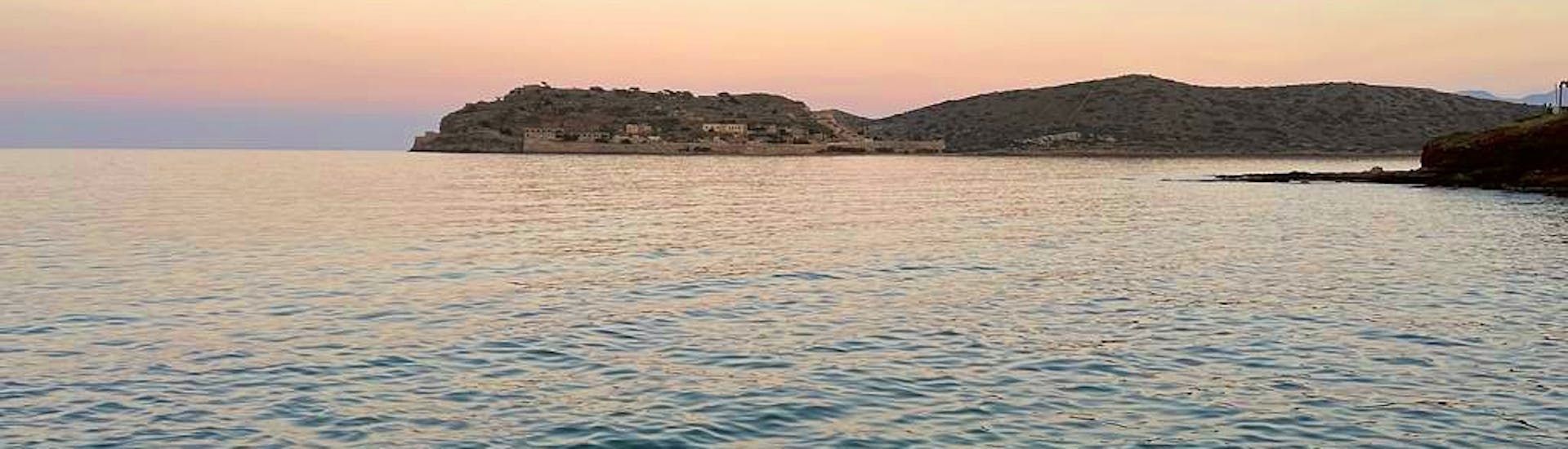 The sunset viewed from the sea during the Private Sunset Boat Trip from Elounda along the coast with Indigo Cruises Elounda.