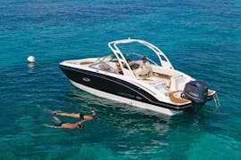 Es Vedra Charter Ibiza luxury boat rental for up to 12 people navigating around San Antonio.
