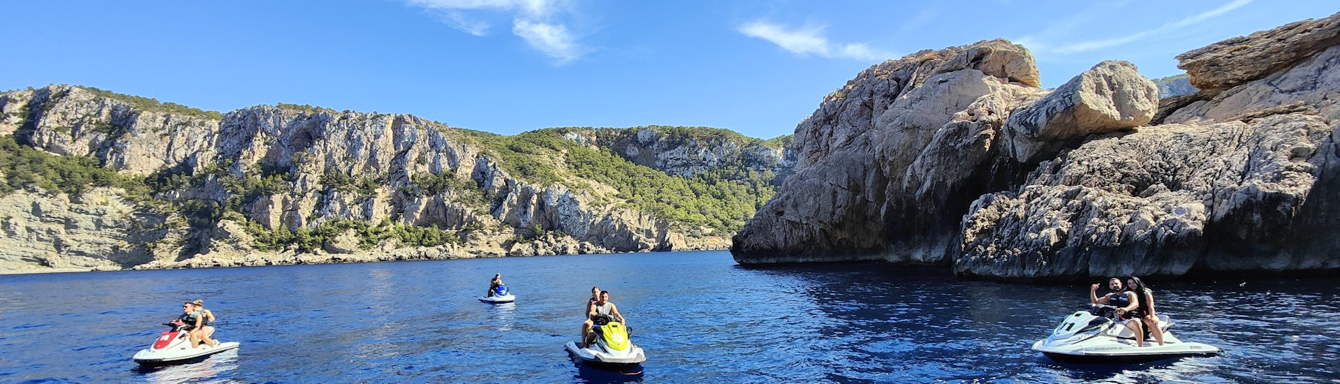 Jet skis enjoying a tour to Cala Salada from San Antonio with Es Vedrà Charter.