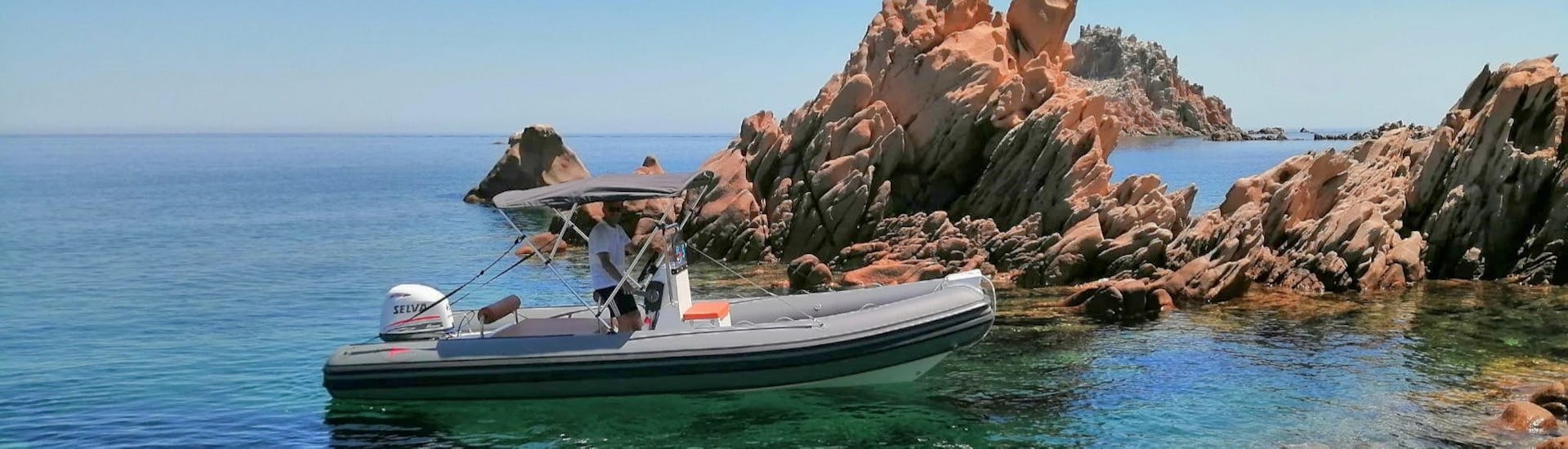 Rocce Rosse's RIB boat viewed from the coast during the RIB Boat Rental in Arbatax (up to 6 people) with Rocce Rosse.
