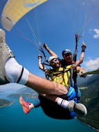 A person and their instructor during the tandem Paragliding over Lake Annecy - Ascendance with K2 Outdoor Annecy.