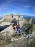 A person and their instructor during the tandem Paragliding over Lake Annecy - Origin'ail with K2 Outdoor Annecy.