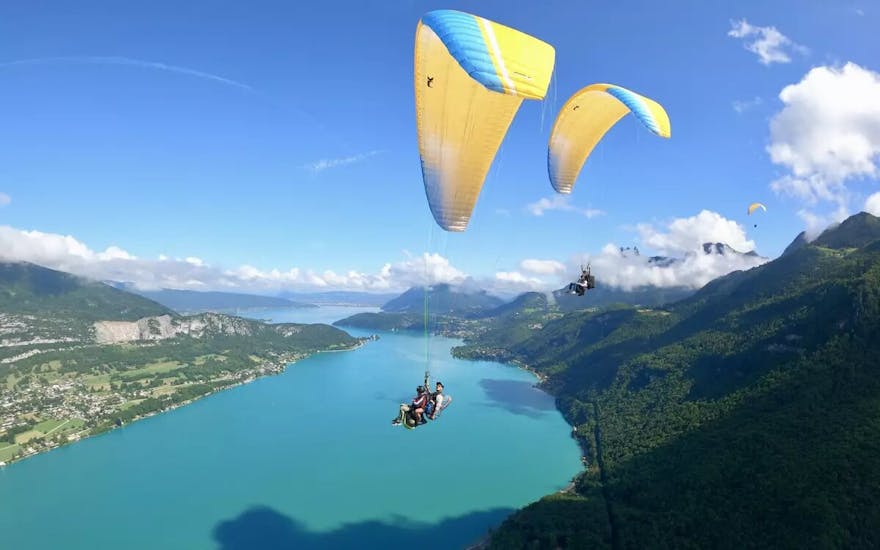 Aerial view of the paraglider above Lake Annecy during the tandem Paragliding over Lake Annecy - Minipouss & Discovery.