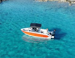 The boat is navigating along Mirabello Bay during the Private Boat Trip along the coastline from Ammoudi with Amoudi Watersports.