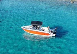 The boat is navigating along Mirabello Bay during the Private Boat Trip along the coastline from Ammoudi with Amoudi Watersports.