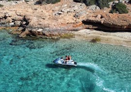 A young girl on the jet ski during the Jet Ski at Ammoudi beach in Agios Nikolaos with Amoudi Watersports.