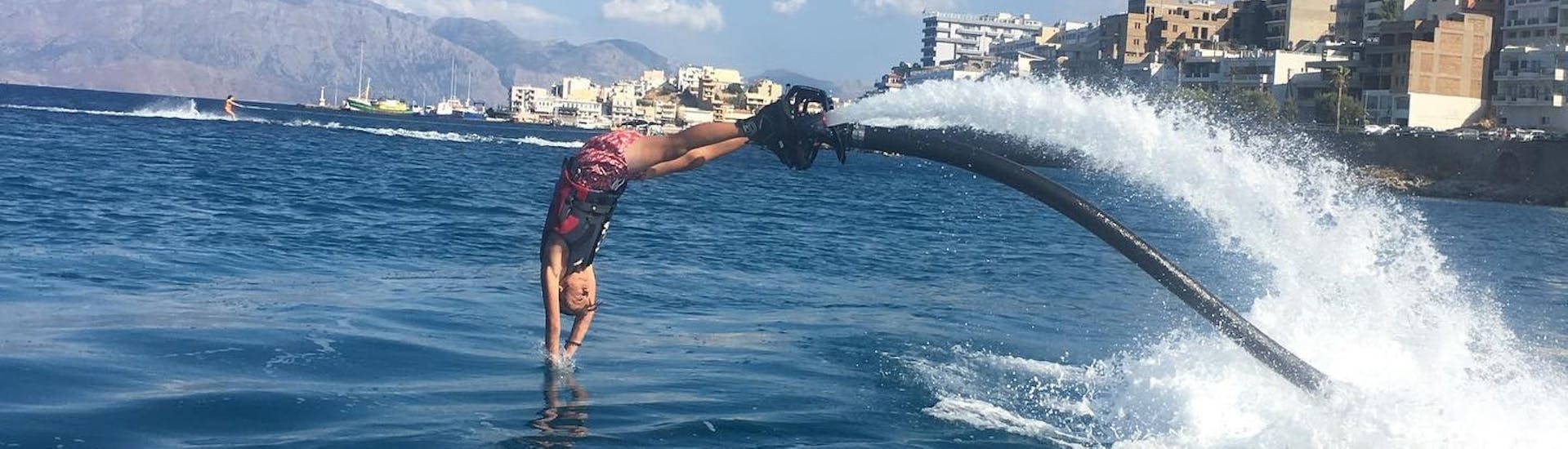 Someone dives into the water during the Flyboarding at Ammoudi Beach in Agios Nikolaos with Amoudi Watersports.