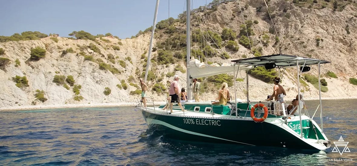 The monohull is exploring the coast around Ibiza during the Private Full-Day Boat Trip around Ibiza with Swimming and Snorkeling with La Bella Verde Ibiza.