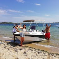 A family spends some time together on the boat during the Boat Rental in Vourvourou (up to 5 people) without Licence with Alfa Boat Rental﻿ Vourvourou.