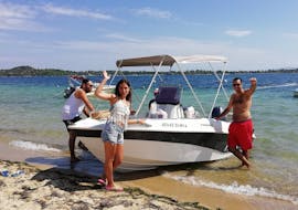 A family spends some time together on the boat during the Boat Rental in Vourvourou (up to 5 people) without Licence with Alfa Boat Rental﻿ Vourvourou.