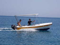 Two young men are exploring the region during the Boat Rental in Bali (up to 6 people) without Licence with The Skippers Bali.