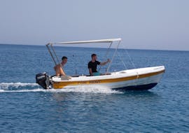Two young men are exploring the region during the Boat Rental in Bali (up to 6 people) without Licence with The Skippers Bali.
