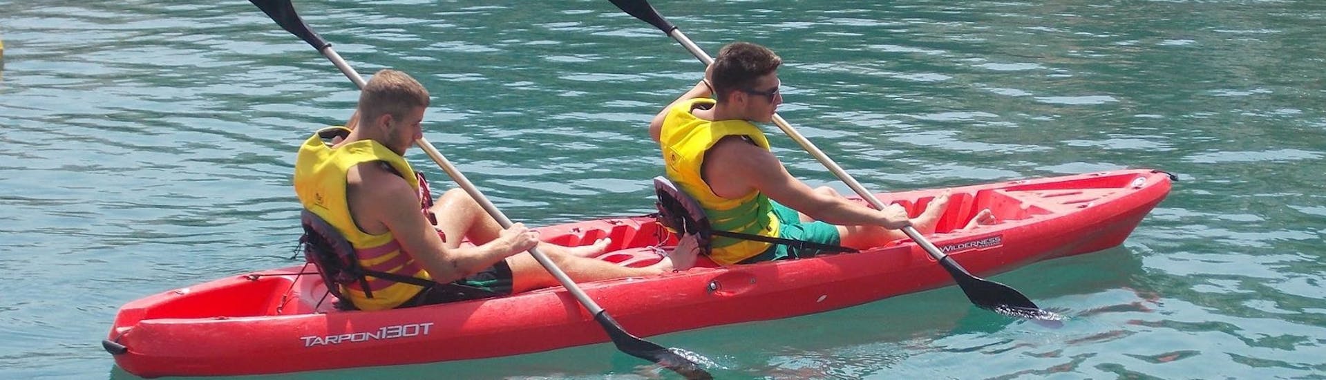 Two people are paddling together on the canoe during the Canoe Hire at Bali on Crete with The Skippers Bali.