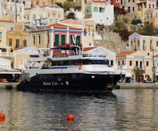 The boat "Discovery" near Symi during the Full-Day Boat Trip to Symi Island with Swimming with Rizos Cruises Rhodes.
