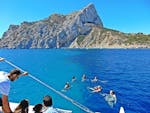 A group of friends enjoy a catamaran trip from Calpe with swimming with Mundo Marino.