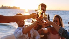 Some participants make a toast at sunset during the Sunset Private Boat Trip from La Spezia to Cinque Terre with Apéritif with 5 Terre Boat La Spezia.
