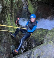 A young girl is trying canyoning during the Canyoning in Madeira for Beginners & Families with Lokoloko Madeira.