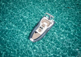 The boat in the middle of the crystal clear waters during the Boat Rental in Cargèse (up to 9 people) with Licence with Nautic Evasion Cargèse.
