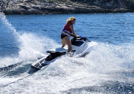 Woman riding on the waves while doing the Jet Ski Safari from Banjole to Levan Island with Seafun Medulin.