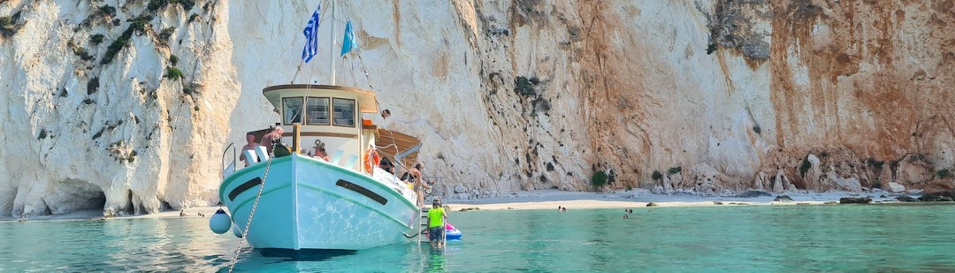 Dreamy Cruises boat standing in front of the White Rocks Beach during their boat trip around Kefalonia with traditional Greek lunch & snorkeling.