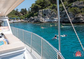 People swimming in turquoise blue water during the Boat Trip from Faliraki to Anthony Quinn Bay with Snorkeling with Sofia Sea Cruises Faliraki.