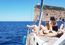 People enjoying the Boat Trip from Alghero to Capo Caccia with Snorkeling & Lunch with Escursioni in Barca Alghero.