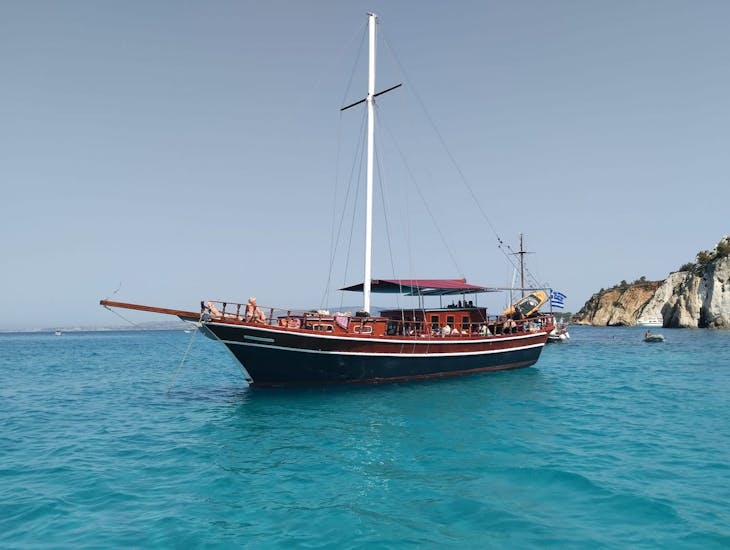 The Queen Bee anchored in the Ionian Sea during their boat trip to White Rocks & Xi Beach with lunch & Snorkeling.