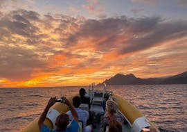 View of the sunset over the Calanques de Piana during the sunset boat trip from Porto to the Calanques de Piana and Capo Rosso with Corse Emotion.