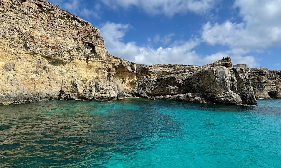 The rocky formations viewed from the boat during the Boat Trip to Comino with Snorkeling & Swimming at the Blue Lagoon with Oh Yeah Malta.