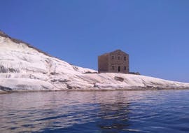 The ancient barracks of the Financial Police seen from the sea during the Private Boat Trip from Agrigento to Punta Bianca Nature Reserve with Forte Mare Agrigento.