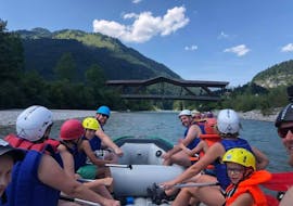 A group in their raft during Action Rafting on the Kitzbüheler Ache with Der Guide Brixtental.