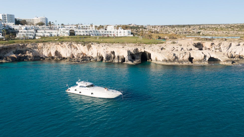 Luxury Yacht in blue water, used for Private Boat Trip from Ayia Napa to Cape Greco & Blue Lagoon with Azure Yacht Club Cyprus.